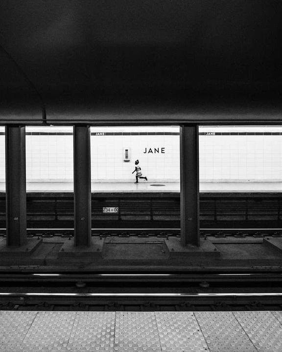 street musician with violin under subway tunnel lights --ar 4:5